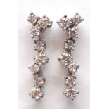 Pair of diamond, 18k white gold earrings
