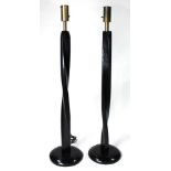 A pair of Modern ebonized and carved floor lamps circa 1970