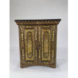 A Chinese lacquered wood dresser cabinet