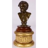 A continental patinated bronze bust of a young boy