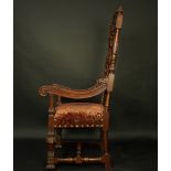 A Jacobean style carved mahogany open armchair