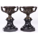 A pair of patinated bronze urns in the Renaissance taste circa 1900