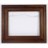 A Newcomb Macklin Stanford White style picture frame having a bronzed finish