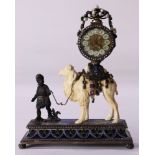 A continental emerald ruby seed pearl and eglomise decorated desk clock in the Moorish taste