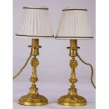 A pair of French ormolu mounted candlesticks mounted as lamps