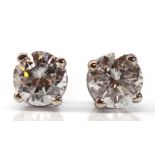 Pair of diamond, 14k white gold earrings