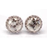 Pair of diamond, 18k white gold earrings