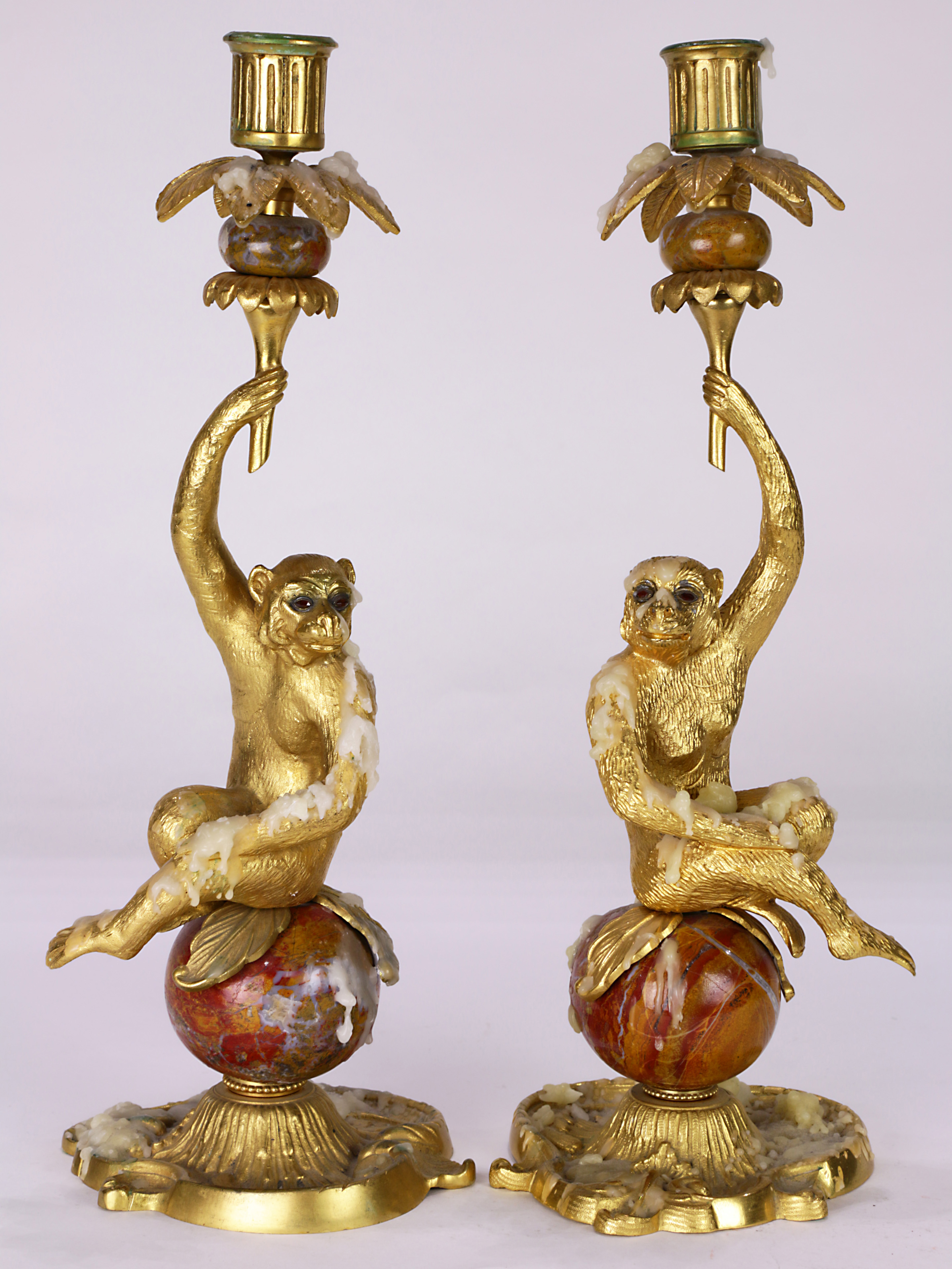 A pair of French ormolu and jeweled candelabra