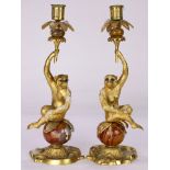 A pair of French ormolu and jeweled candelabra