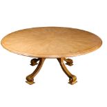 A Therien Studio Volute walnut circular dining table in the Italian Rococo style