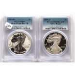 A pair of $1 Silver Eagle coins