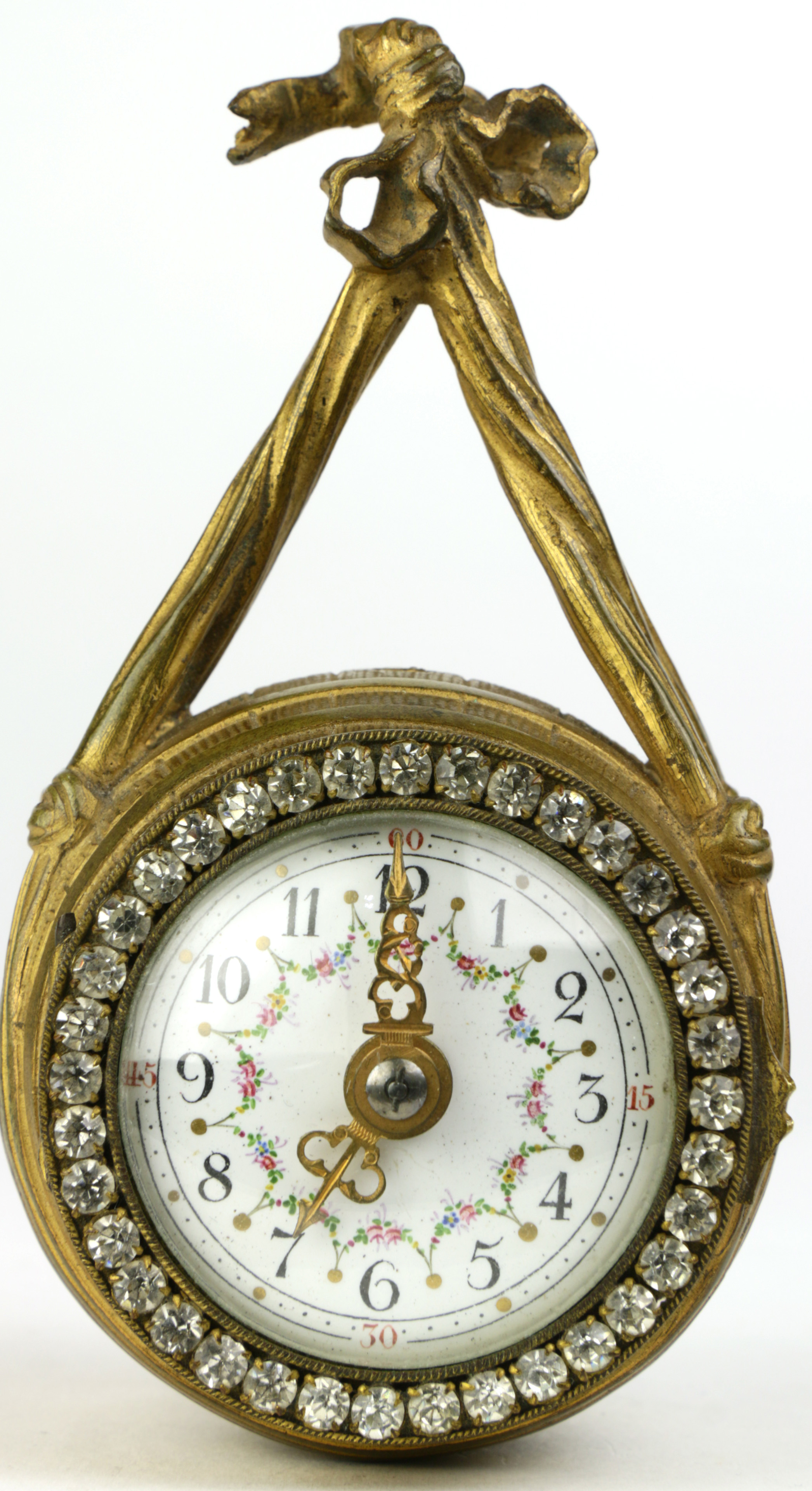 An antique "jeweled" gilt brass mounted wall clock, retailed by M. J. Tobias & Co.