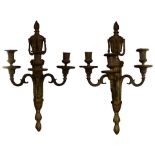 A pair of French Louis XVI patinated bronze sconces