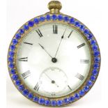 An antique "jeweled" brass mounted paperweight desk clock