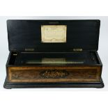 A large marquetry decorated Swiss cylinder music box circa 1860