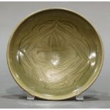 A Chinese Celadon YaoZhou Style Carved Flower Plate