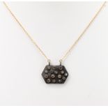 Diamond, blackened silver, 14k yellow gold pendant-necklace