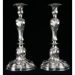 A pair of Continental Rococo style .800 silver candlesticks