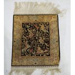 A fine silk Hereke rug, signed