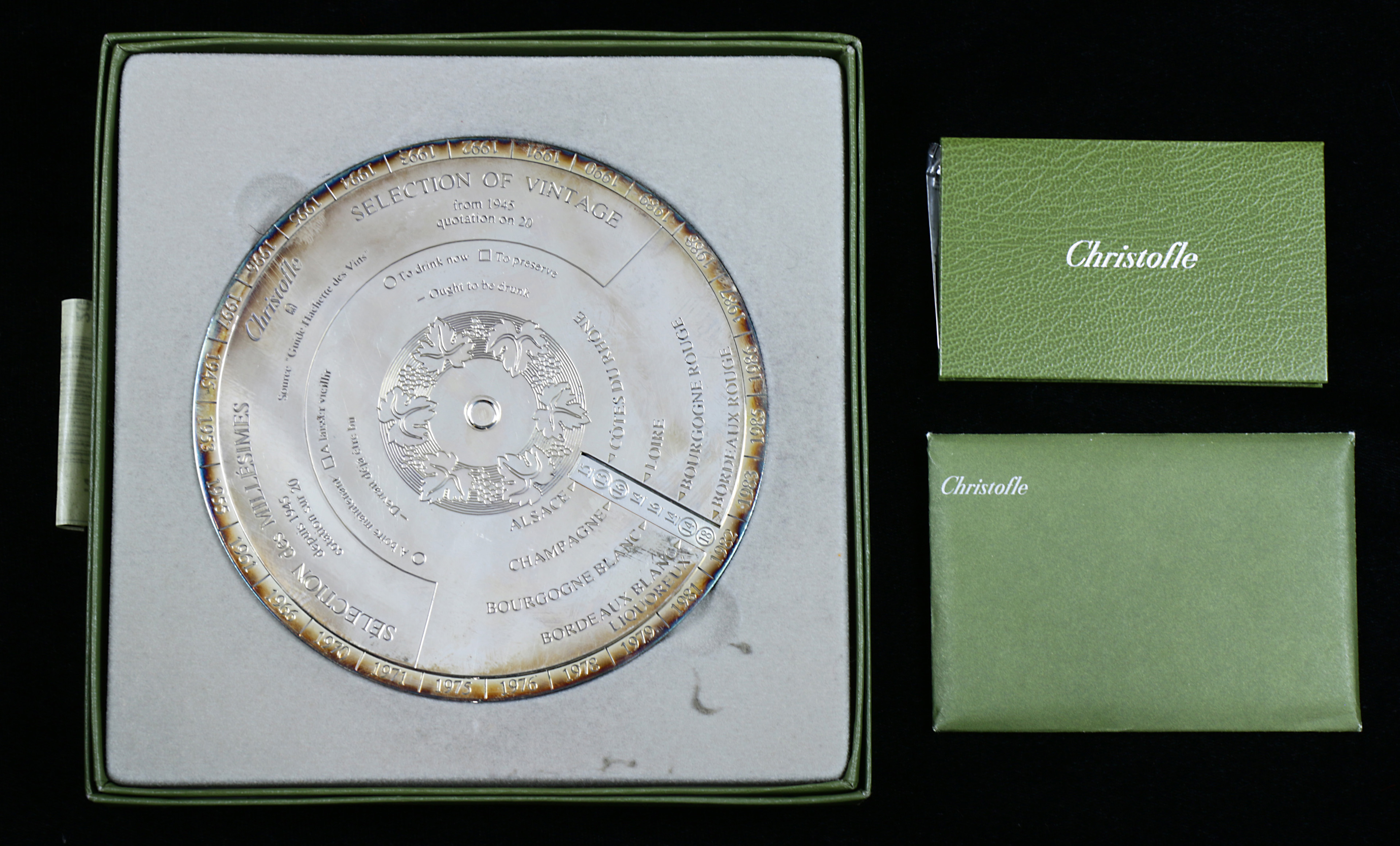 A Christofle France silverplate wine bottle coaster