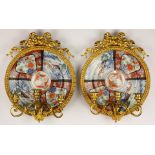 A pair of ormolu mounted girandoles