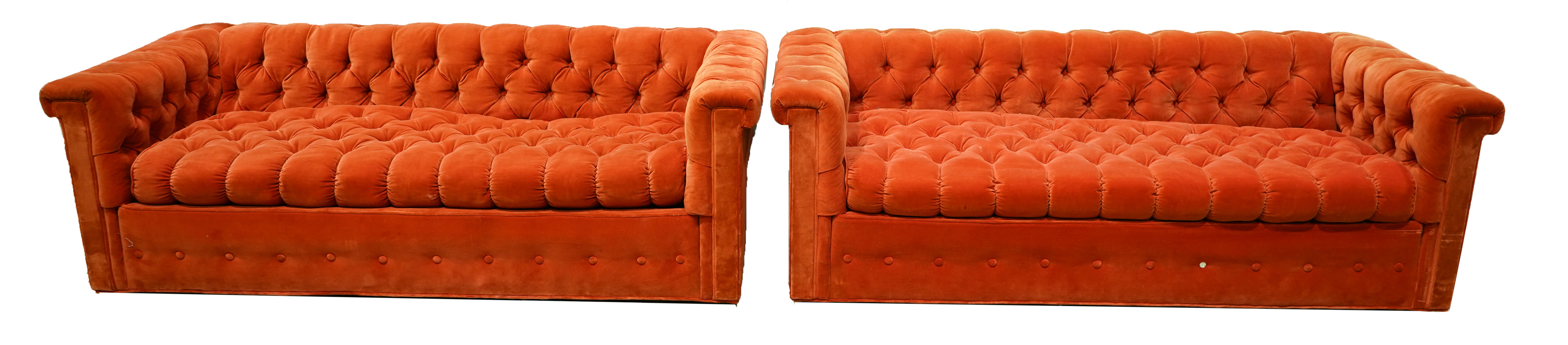 A Pair of John Stuart orange velvet upholstered Chesterfield style sofas