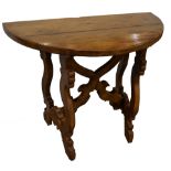 A Baroque style walnut console table