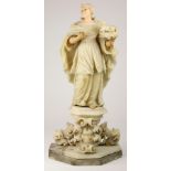 An Italian stone carved sculpture depicting St Agnes