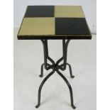 A pair of tile top bistro tables