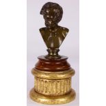 A Barbedienne foundry patinated bronze bust of a young boy