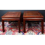 A pair of two Chinese hardwood low tables