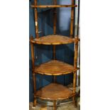 A bamboo and leather corner etagere