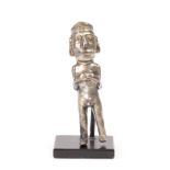 A Peruvian silver figurine