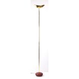 An Arteluce brass floor lamp