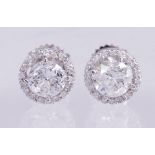 Pair of diamond, 18k white gold earrings