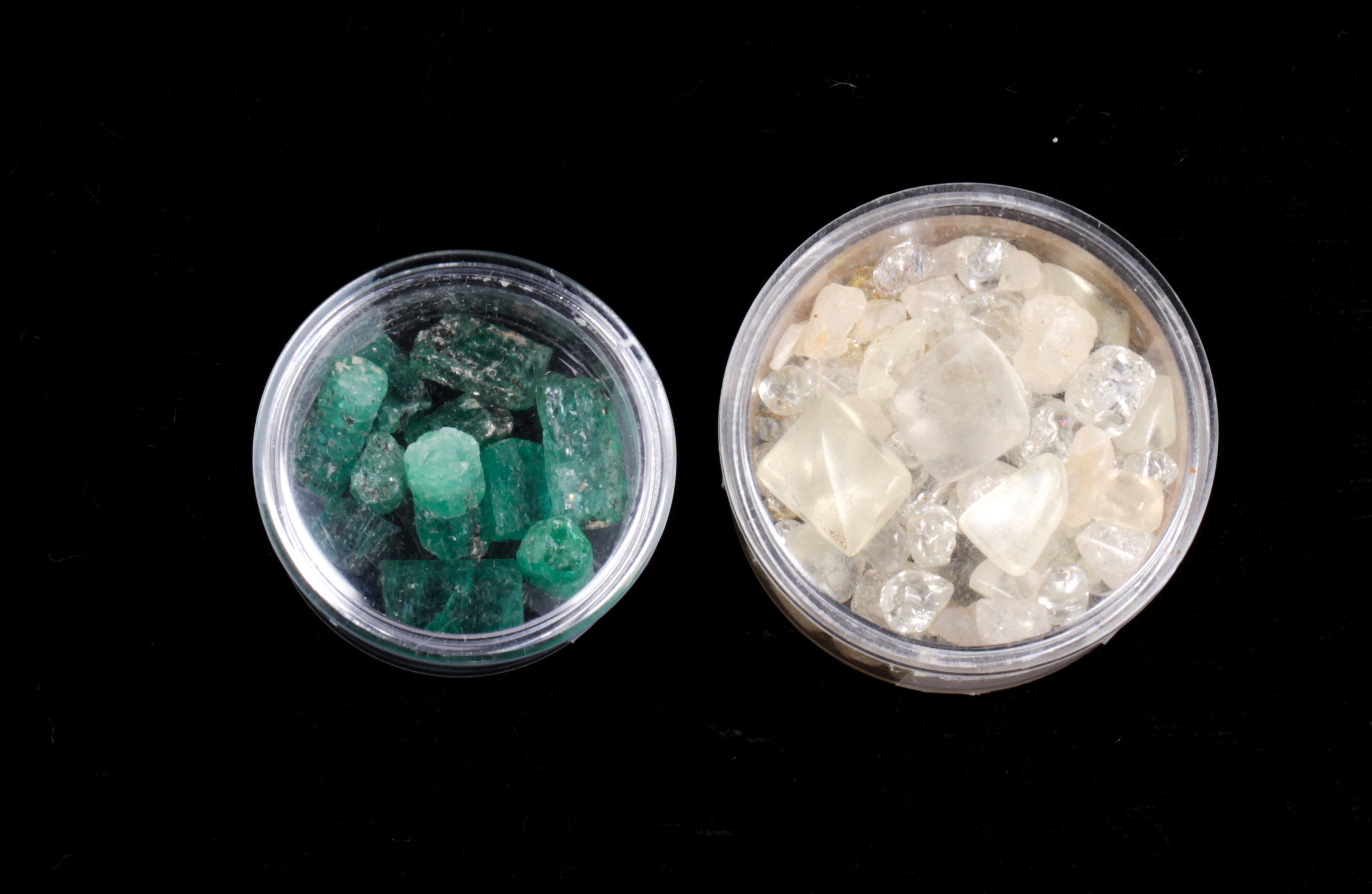 Collection of emerald crystals and tumbled stones