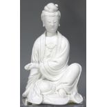 A Chinese Seated DeHua GuanYin Figure