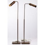 A pair of Contemporary brass adjustable floor lamps