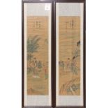 (lot of 2) Thin pair of scroll paintings depicting two figures in waterfall landscape