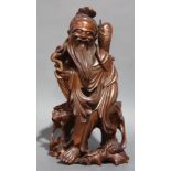A Chinese Boxwood Figure of a Standing Fisherman