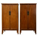 A pair of elm cabinets