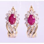 Pair of ruby, diamond, 10k yellow gold earrings