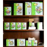 Three shelves of Tweety's Enchanted Garden collectibles