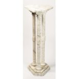 A Classical style variegated marble pedestal