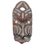 Modern Maori carved head, having circular shell eye
