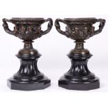 A pair of patinated bronze urns in the Renaissance taste circa 1900