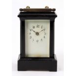 Ebonized carriage clock, having an Arabic numeral dial, 4"h