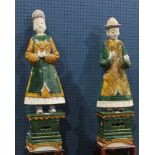 Massive pair Tang style sancai glazed figures of attendants on stands