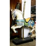 A vintage carved and polychrome decorated carousel style horse