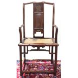 A Chinese blackwood armchair inset with woven seat in the back